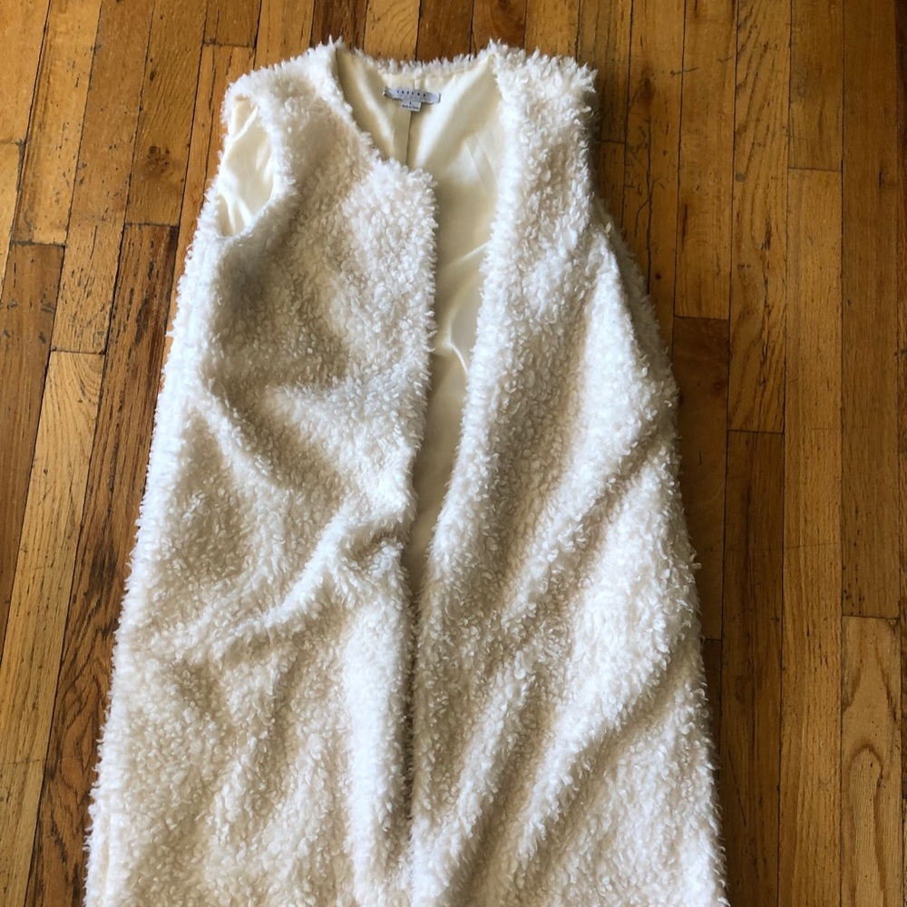 Long white furry vest